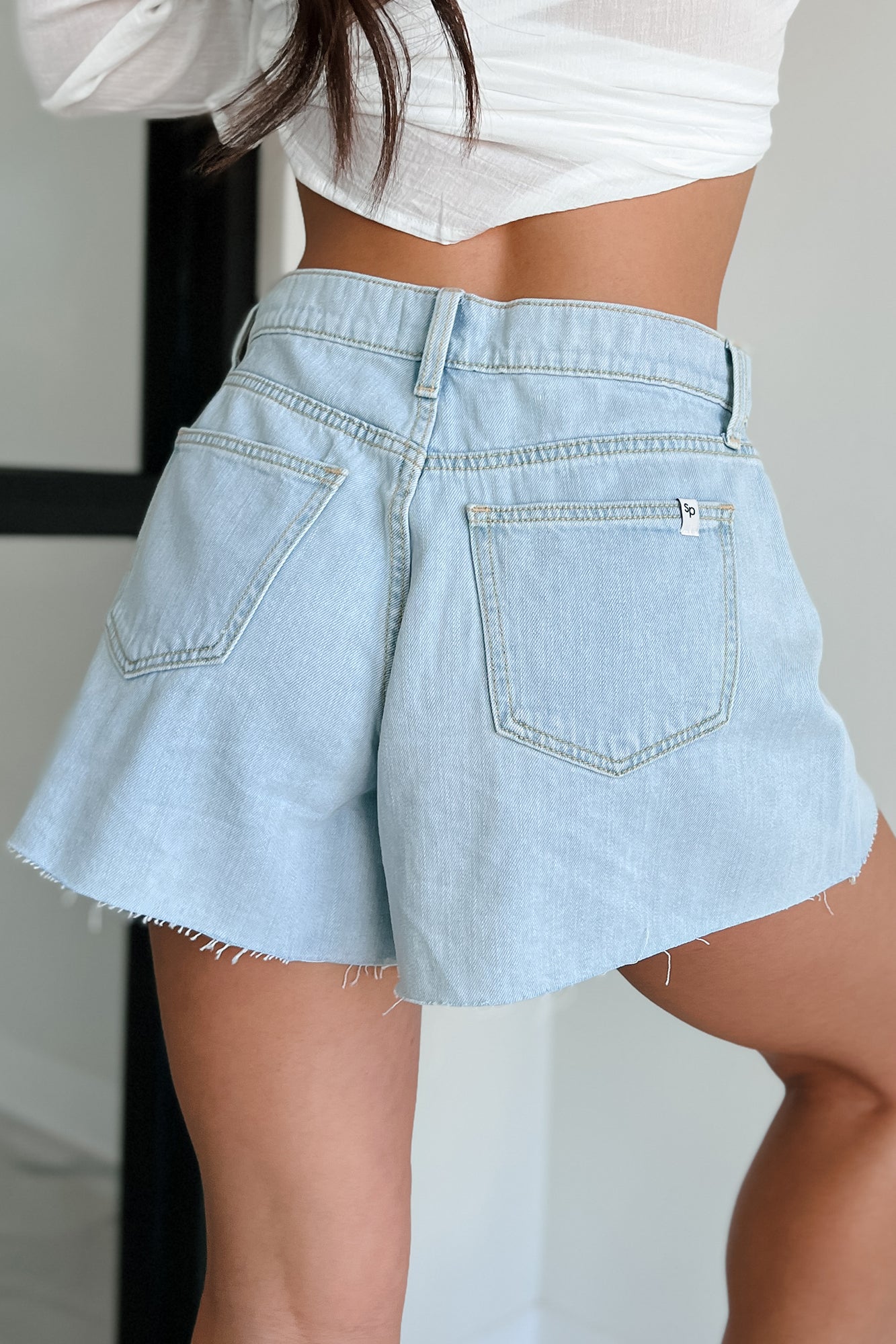 Evander High Rise Raw Hem Denim Sneak Peek Shorts (Light)